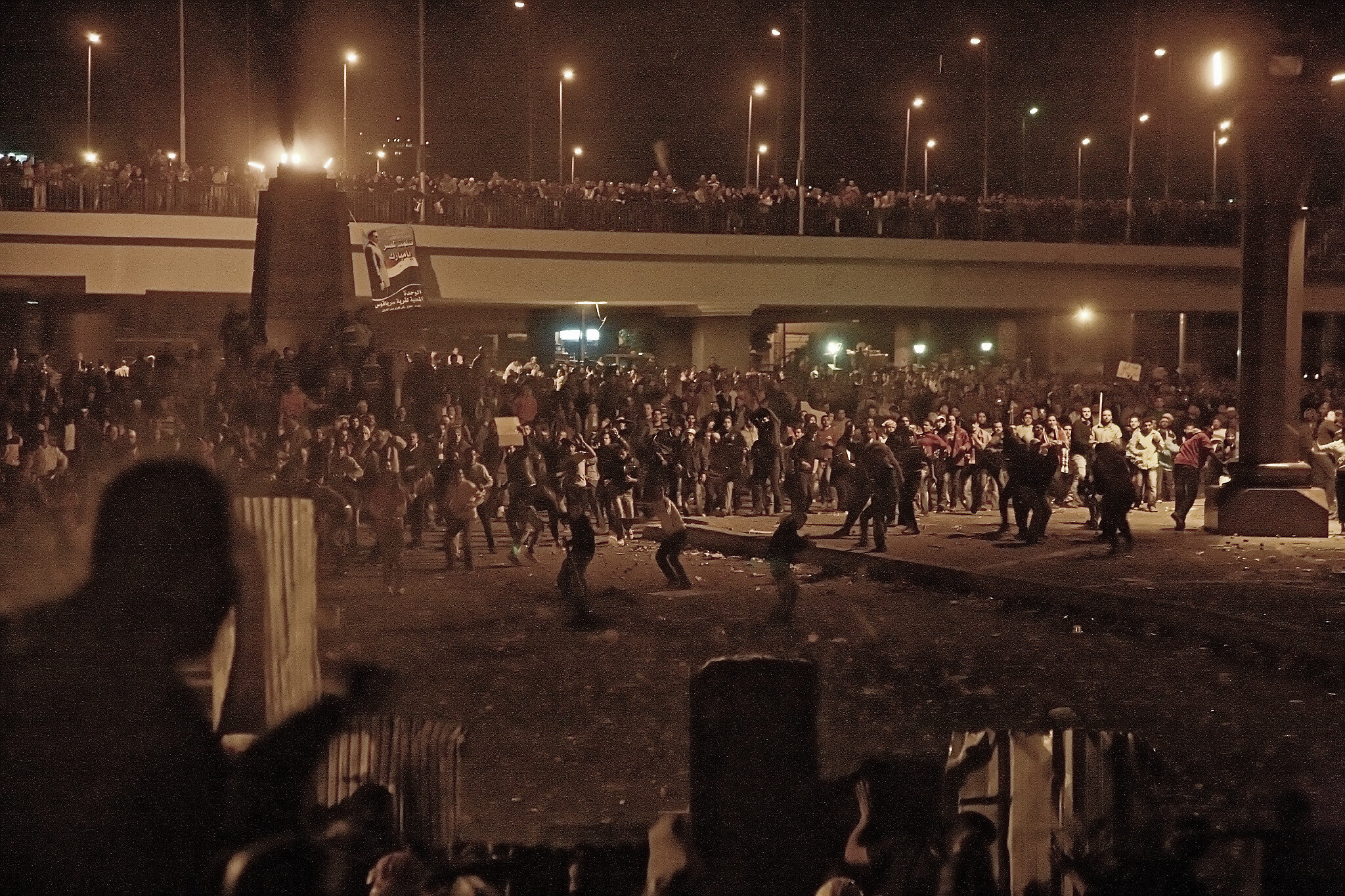 Supporters of the then-embattled Egyptian President assault from the Egyptian Museum side the thousands defending the square, in what was to prove a failed effort to dislodge them.