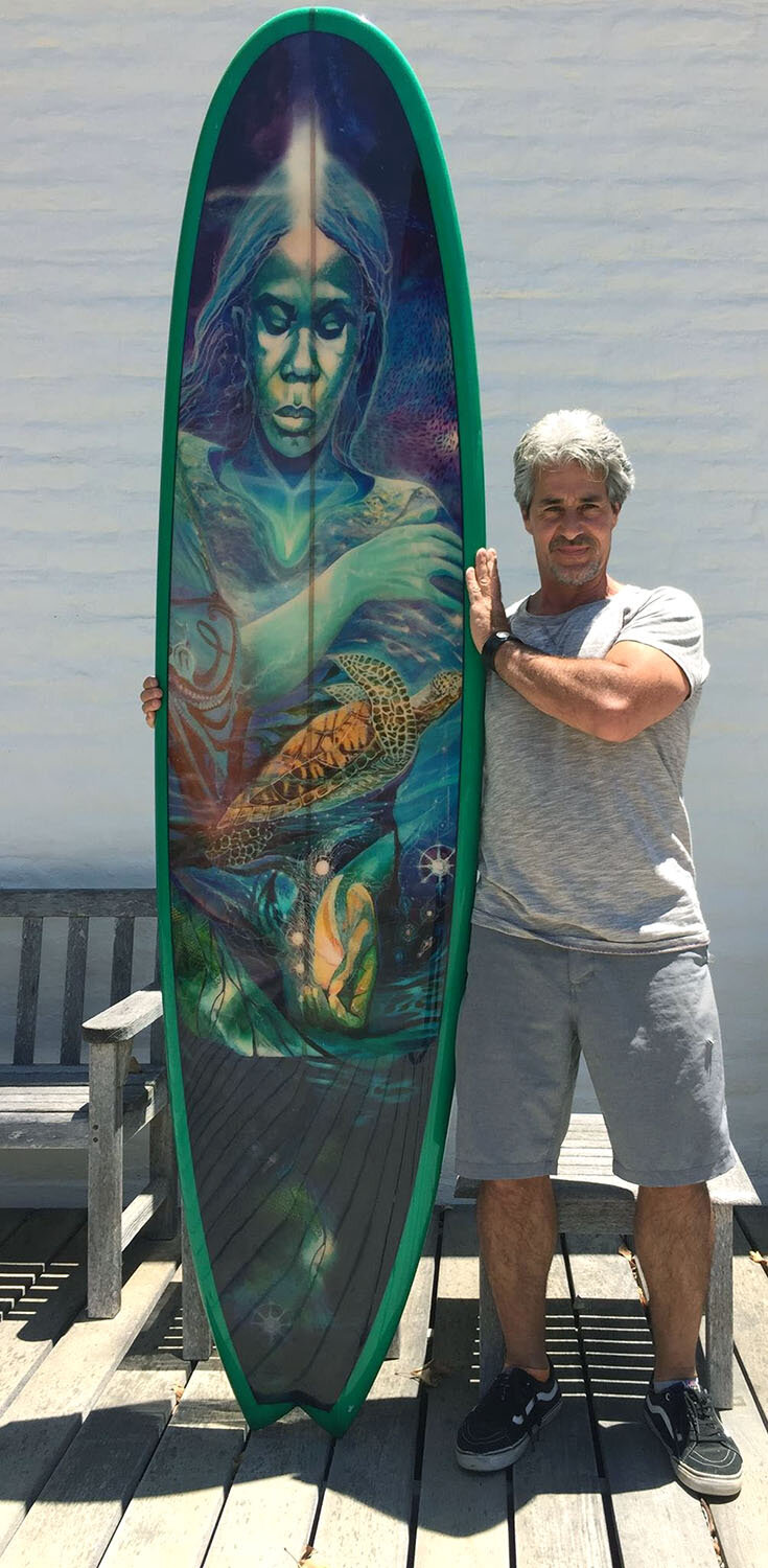 Francisco Letelier with the surfboard derived from 