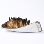 Issam Kourbaj, Dark Water, Burning World, 2016, Selection of small boats, made from recycled bicycle mud-guards, packed with upright burnt matches