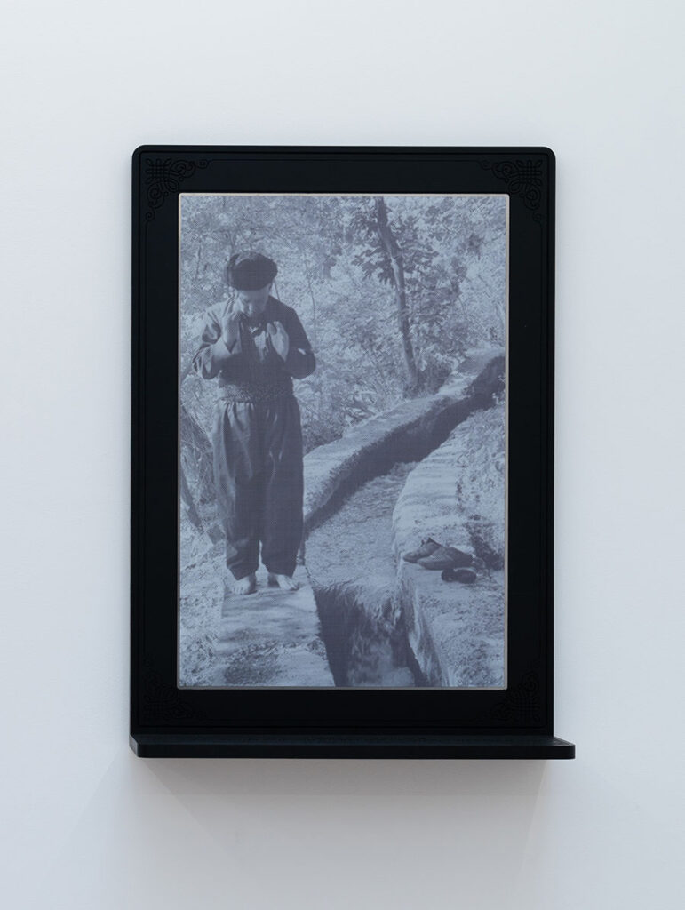 Rushdi Anwar, "The Invisible Line — He Prays in Iraq, His Shoes in Iran, Both Are in Kurdistan,"digital-UV print on stainless steel, synthetic paint on wood, 64 x 17 x 91 cm, 2023 (courtesy ab-anbar). 