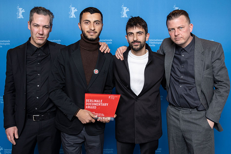 Directors of No Other Land, Basel Adra (center left) and Yuval Abraham (center right) flanked by their producers. Photo: Berlinale