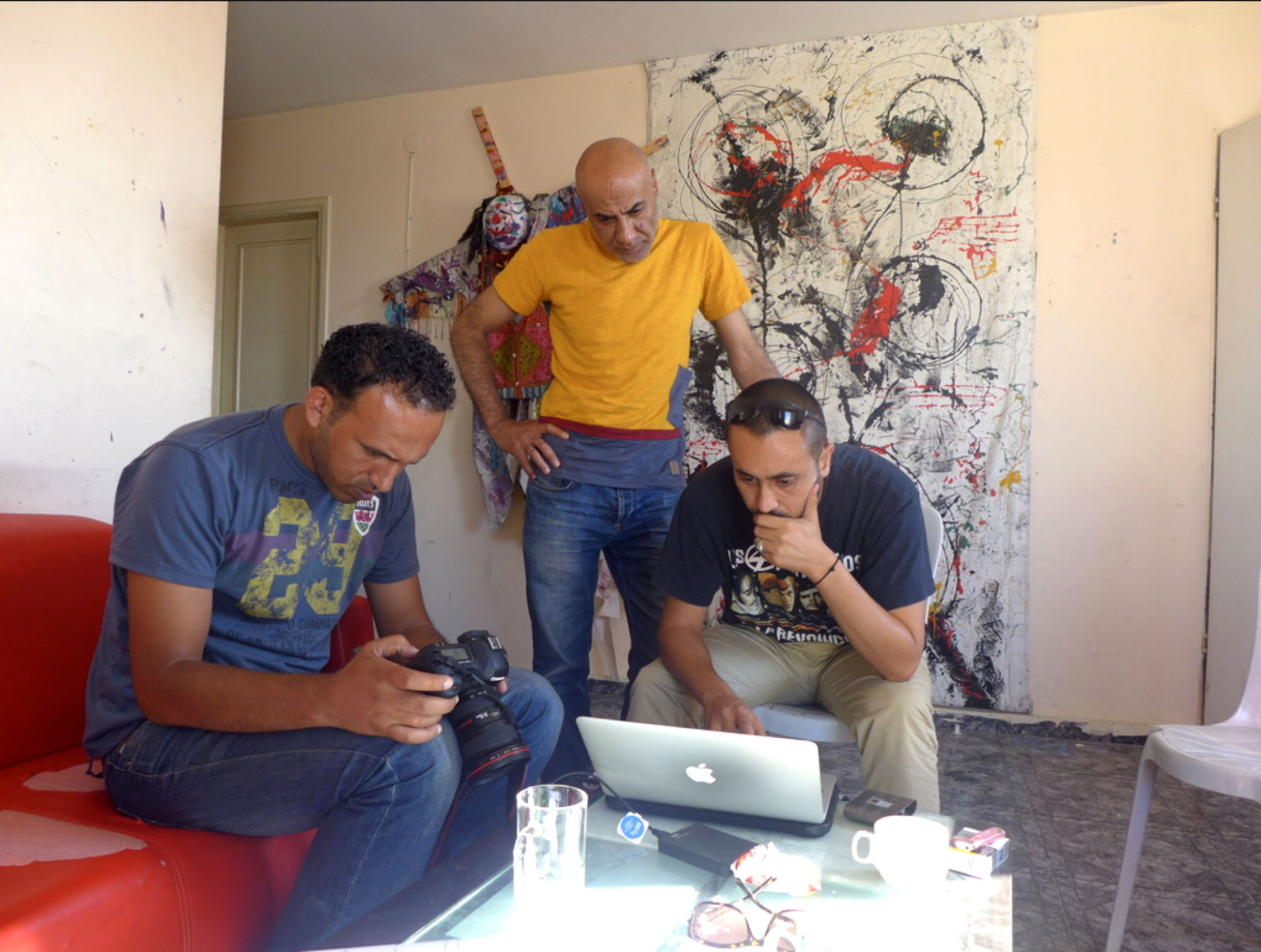Production meeting with Khalil, Ibrahim, and Emad — producer and cinematographers, respectively.