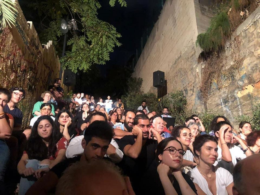 A captivated audience in Beirut for Hanane's street theatre.