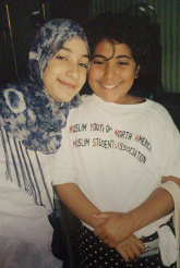 The author at age 11 (r) with her cousin, at the Muslim conference.