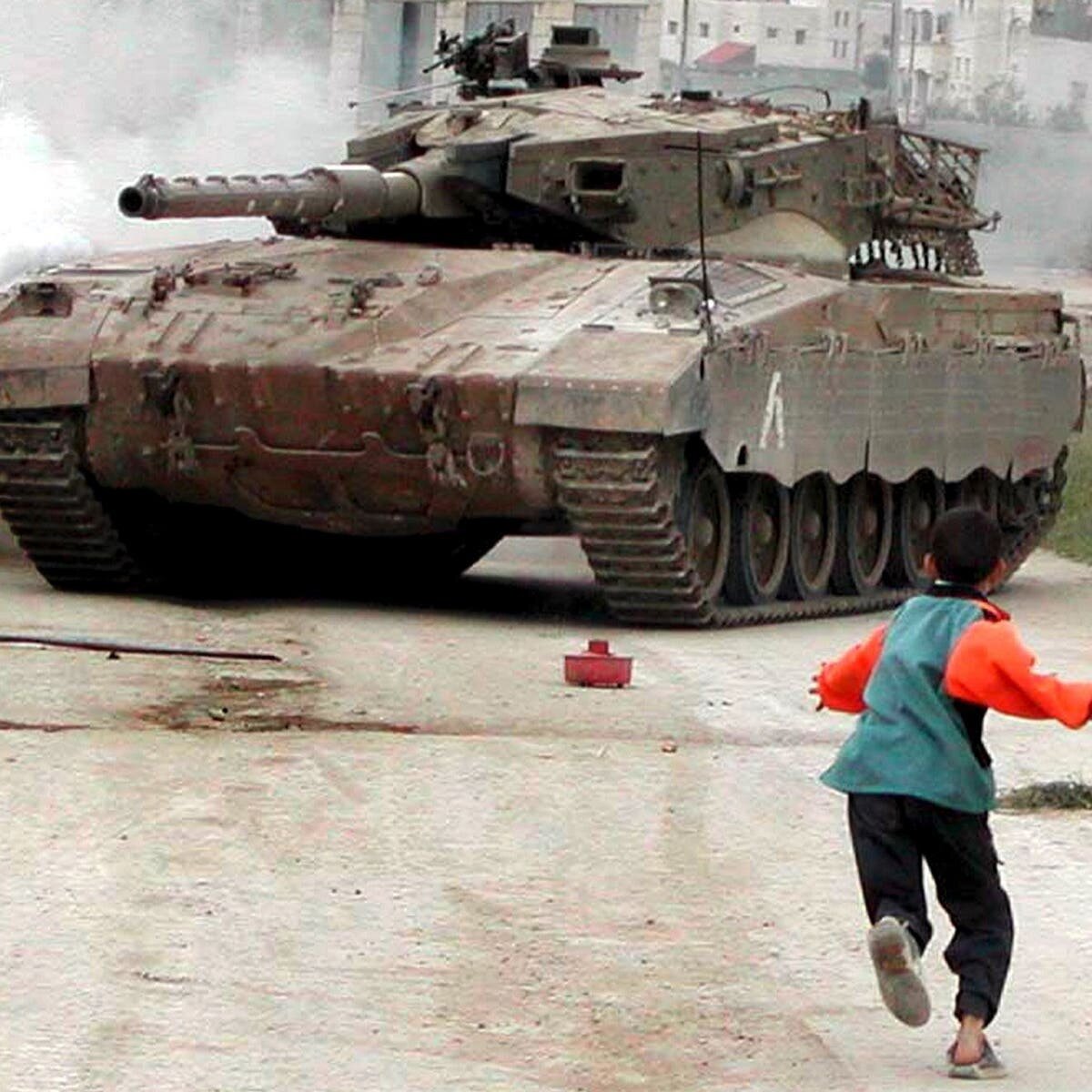 Israeli tanks face off against Palestinian stones (photo courtesy Haaretz).