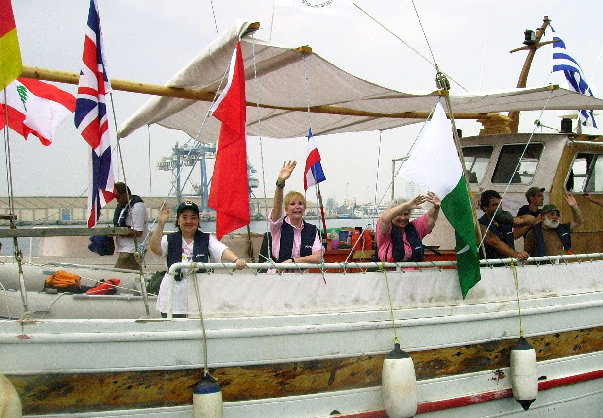 Freedom Sailors Greta Berlin and Mary Hughes Thompson, center, on the Free Gaza, one of two boats that broke the siege of Gaza.