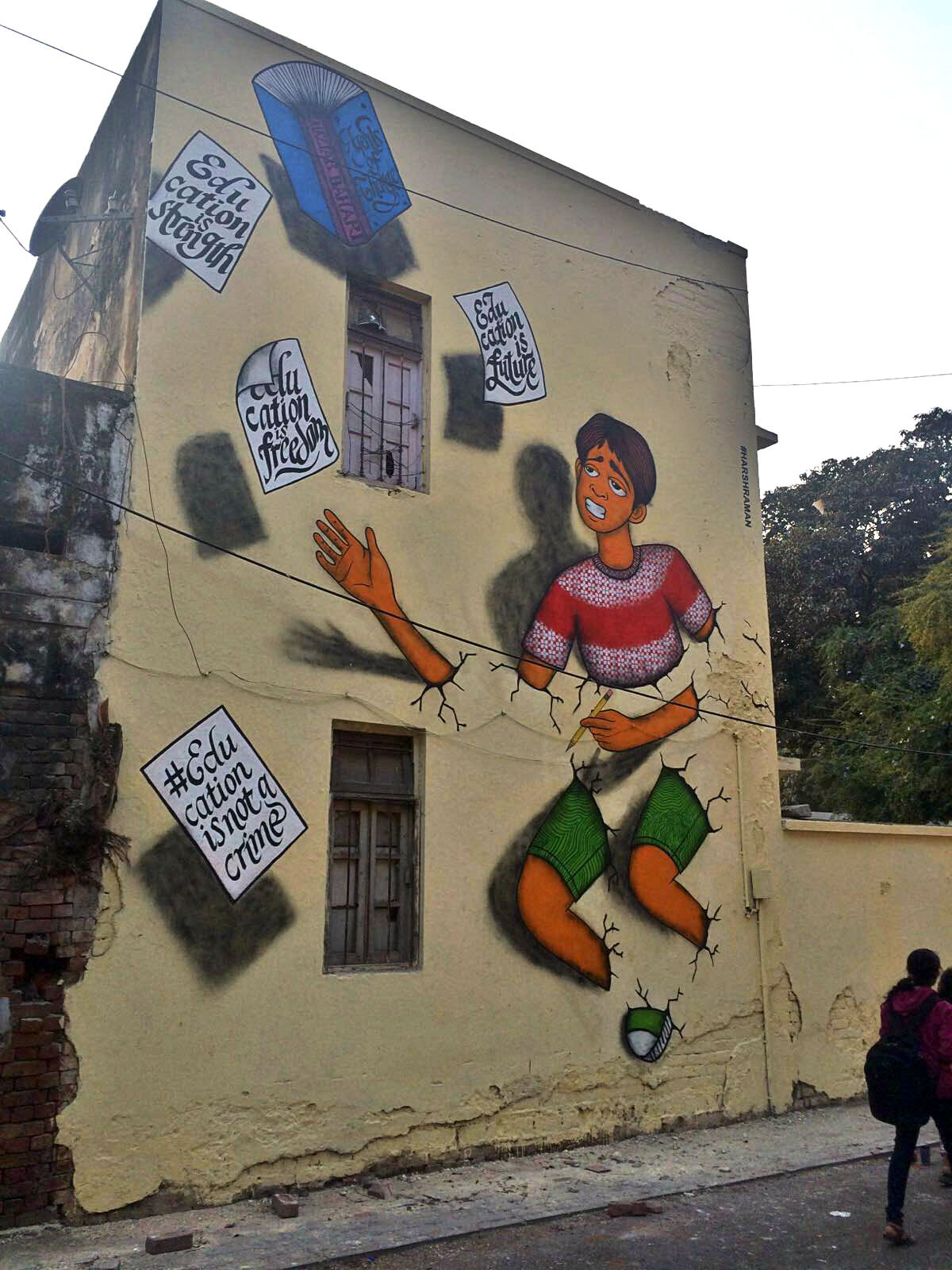 NEW DELHI, INDIA This mural of a young Baha'i unable to break through the wall of the system and floundering at a basic level, his education, was designed and painted by <a href=