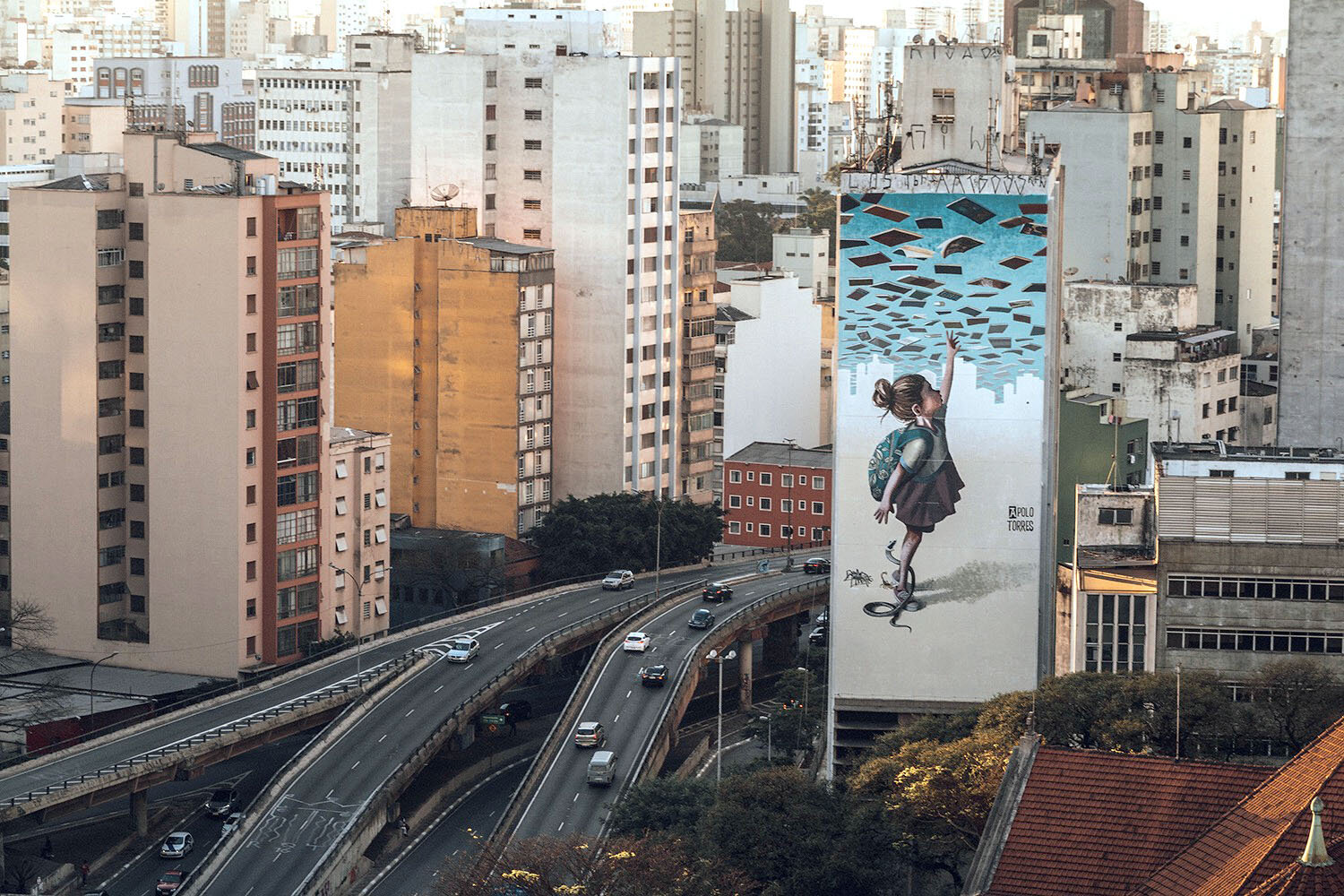 SÃO PAULO, BRAZIL A schoolgirl reaching for knowledge with a snake at her heels, by <a href=