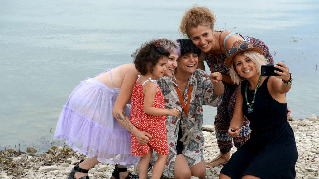 Director Afraa Batous center surrounded by her three friends on a road trip