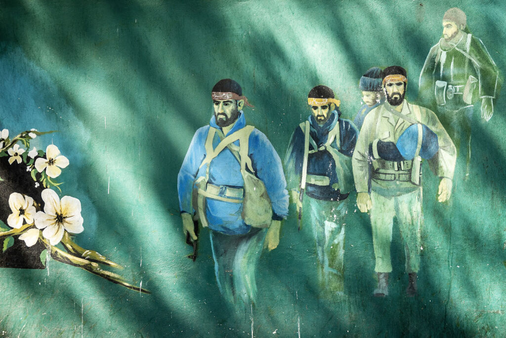 Revolutionary soldiers, fighters, martyrs mural in downtown Tehran outside old US embassy photo Jack Malipan