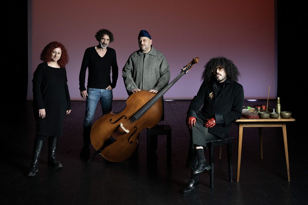 (l-r) Lina Majdalanie, Rabih Mroueh, Raed Yassine and Souhaib Ayoub, on the playbill for Hartaqât, showing in Paris as part of the Festival d'Automne 2023. Photo Nora Rupp.