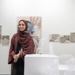 Artist Alia H. Loutah surrounded by her work in Dubai