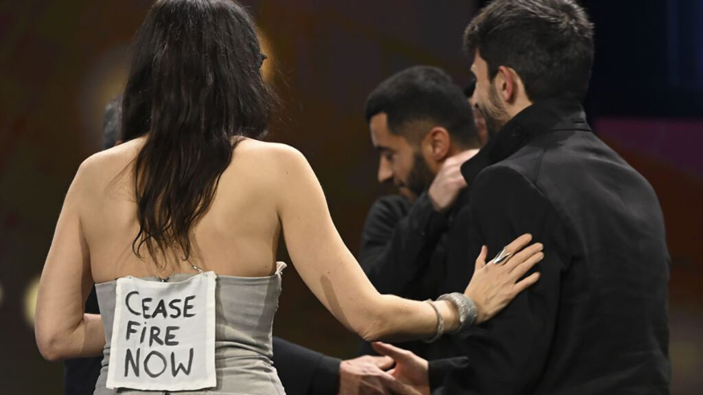 Berlinale jury member Verena Paravel congratulates Yuval Abraham and Basel Adra