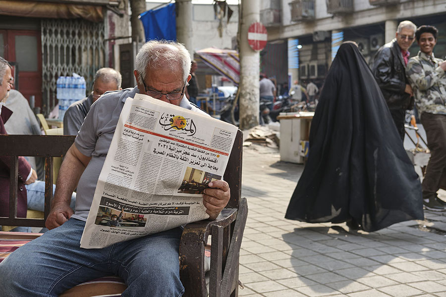 Man reads a newspaper at a cafe on al-Rashid Street. Baghdad, November 2020 (all photos Nabil Salih).
