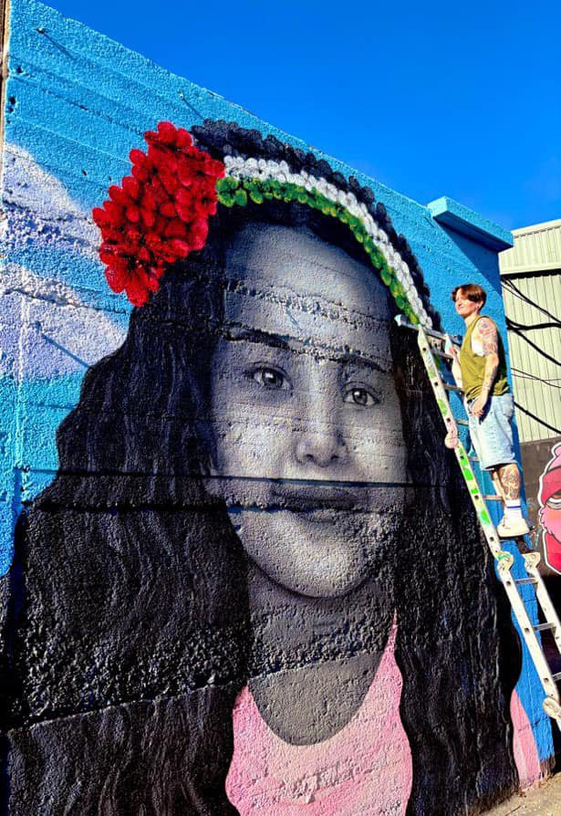 Mural, "Remembering Hind Rajab," killed by the Israeli military after being the sole survivor of Israeli tank fire on the vehicle in which she had fled with six relatives. Mural by Emmaline Blake outside the grounds of Dalymount Park, Dublin, Ireland.