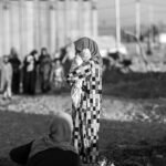 Iraqi woman in a camp for people from the city of Mosul who were internally displaced following the takeover of the city by Islamic State in 2014. Photograph by Iason Athanasiadis.