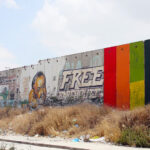 Khaled Jarrar, “Through the Spectrum,” painted on the Israeli separation wall near Qalandiya checkpoint in the occupied West Bank, 2015 (courtesy of the artist).