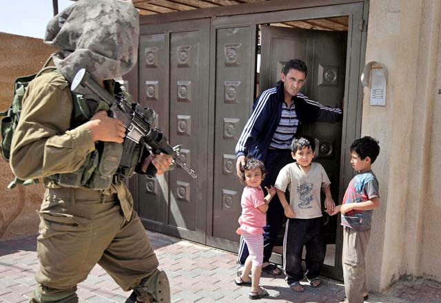 Palestinian children in the West Bank get used to having guns pointed at them. Photo: The Jordan Times