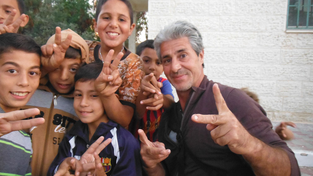 Francisco Letelier with children in village of Budrus, West Bank, Palestine 2014 (courtesy Francisco Letelier).