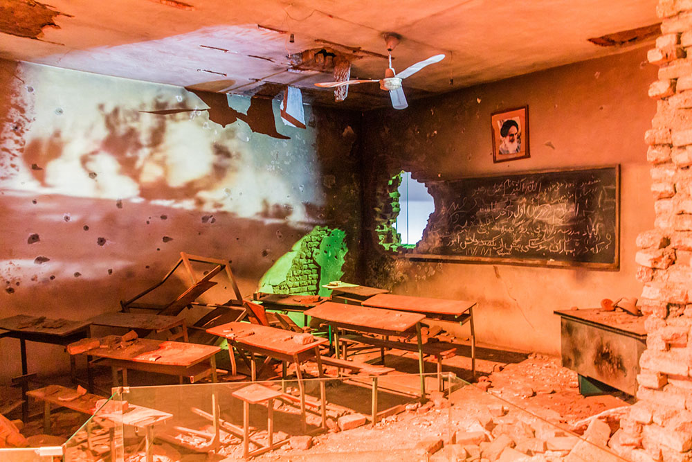 Exhibit of a bombed classroom in the Islamic Revolution and Holy Defense Museum in Tehran, Iran (photo Matyas Rehak).