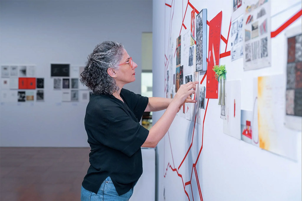 Ala Younis installing the exhibition Past of a Temporal Universe at NYU Abu Dhabi Art Gallery, Sep 2025