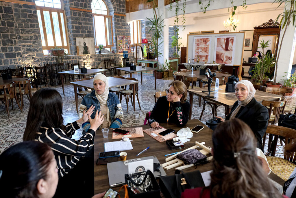 Lama Abboud speaks with some of the ladies participating in the cultural and architectural heritage workshop