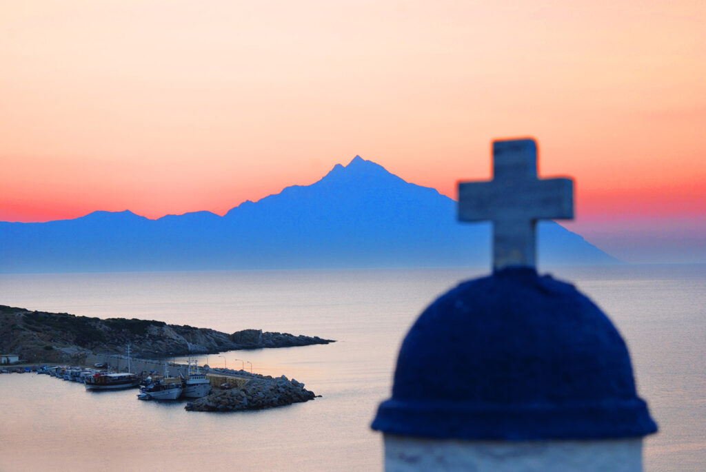 Mount Athos at sunrise with Mount Athos across the bay from Chalkidiki Greece. Serban Enache