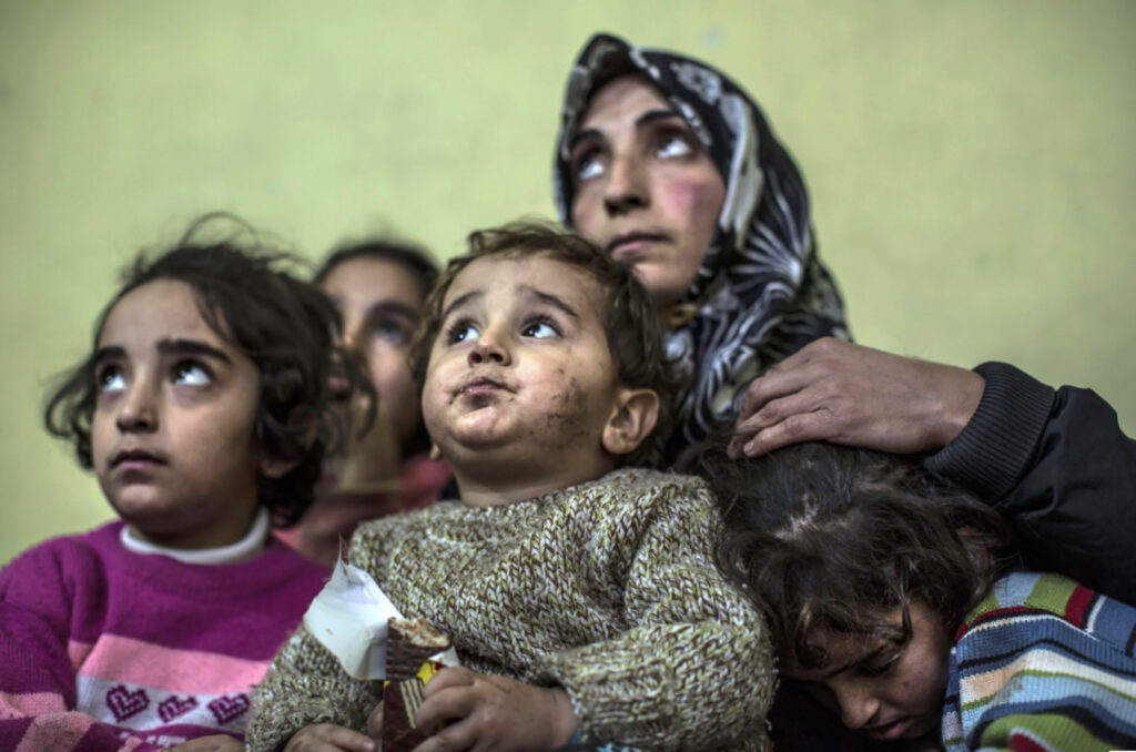 Refugee mother and children from Afghanistan, 2021 (photo courtesy Iason Athanasiadis).
